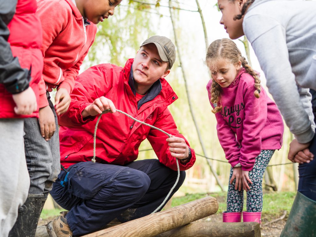Cub being taught rope skills
